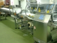 Групповая упаковка колбасных изделий в газовой среде на горизонтальной упаковочной машине Shamal servo фирмы PFM
